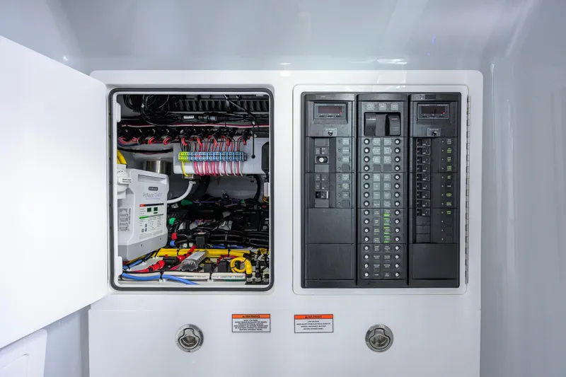 Slide: The Image of Electrical panel of 2026 Valhalla Boatworks V-37, showcasing wiring and circuit breakers. - 26