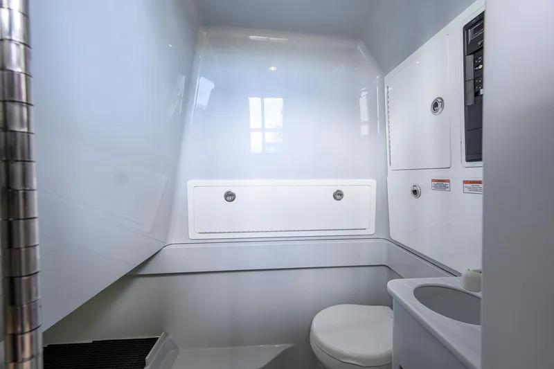 Slide: The Image of 2026 Valhalla Boatworks V-37 interior bathroom with modern fixtures and sleek design. - 27