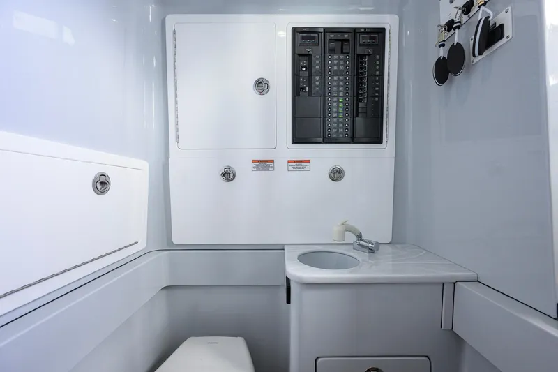 Slide: The Image of Interior of 2026 Valhalla Boatworks V-37, featuring control panels and compact sink area. - 28
