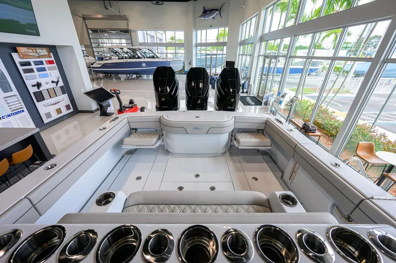 Slide: The Image of 2026 Valhalla Boatworks V-37 interior with triple outboard engines in a showroom setting. - 29