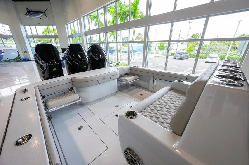 Slide: The Image of 2026 Valhalla Boatworks V-37 interior with seating and outboard motors in showroom. - 33