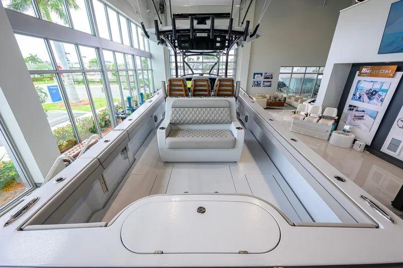 Slide: The Image of 2026 Valhalla Boatworks V-37 interior with luxurious seating in a showroom setting. - 35
