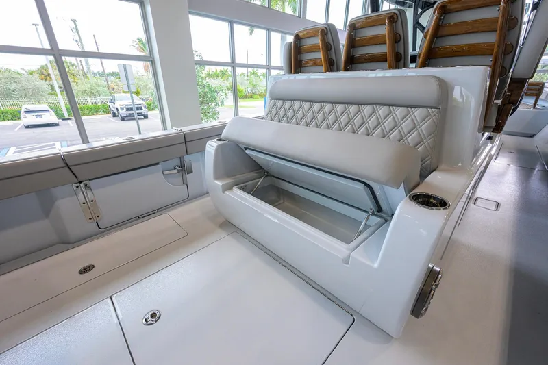 Slide: The Image of 2026 Valhalla Boatworks V-37 interior with open storage compartment and luxurious seating. - 38