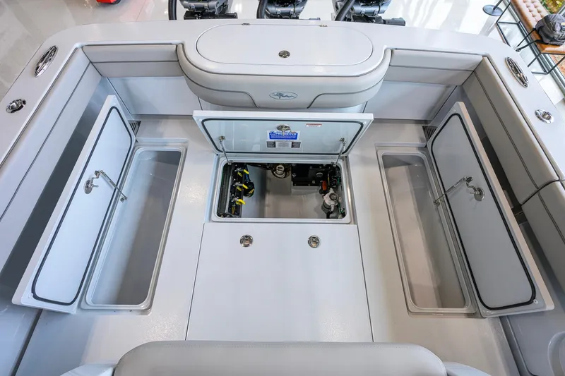 Slide: The Image of 2026 Valhalla Boatworks V-37 interior with open storage compartments and sleek design. - 43
