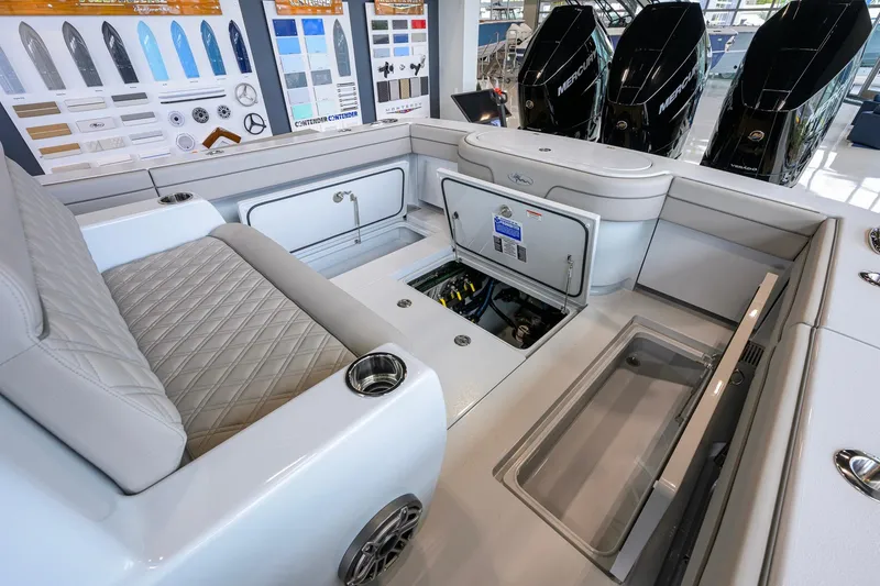 Slide: The Image of 2026 Valhalla Boatworks V-37 interior with open storage compartments and sleek seating. - 44