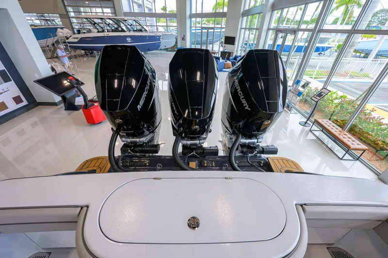 Slide: The Image of 2026 Valhalla Boatworks V-37 with triple Mercury outboard engines in showroom. - 51