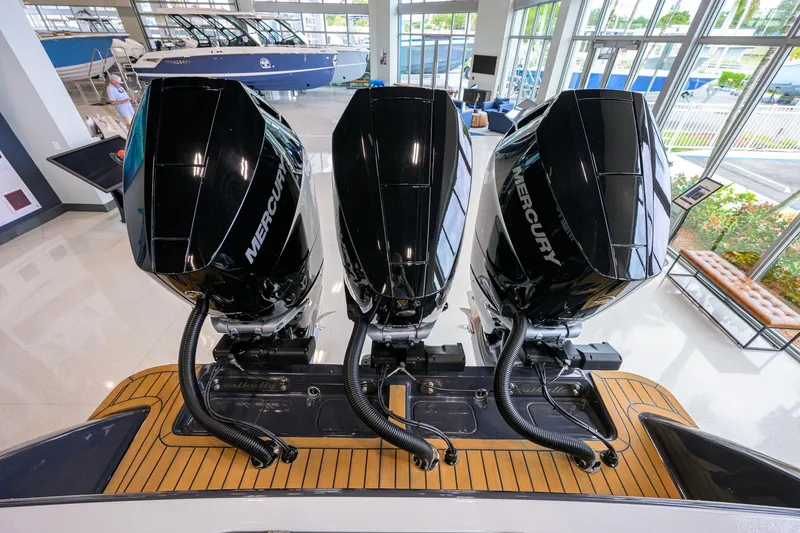 Slide: The Image of 2026 Valhalla Boatworks V-37 with triple Mercury outboard engines in showroom. - 52