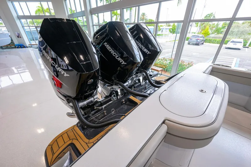Slide: The Image of 2026 Valhalla Boatworks V-37 with triple Mercury outboard engines in showroom. - 53