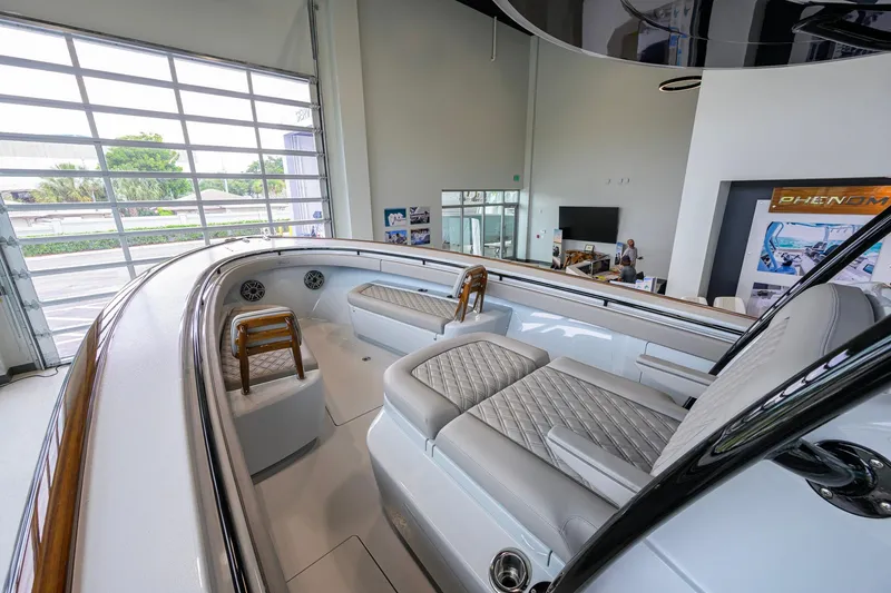 Slide: The Image of 2026 Valhalla Boatworks V-37 interior with luxurious seating and modern design in showroom. - 8