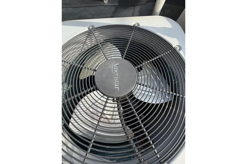 Slide: The Image of Ameristar air conditioning unit fan with protective grille, Sunstar 16x65, year 2000. - 38