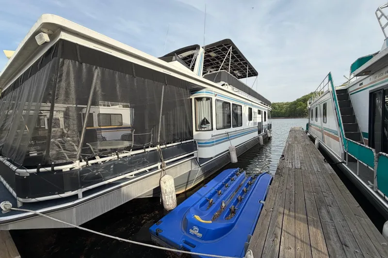 Slide: The Image of Houseboat docked on a lake, Sunstar 16x65 model, year 2000. - 56