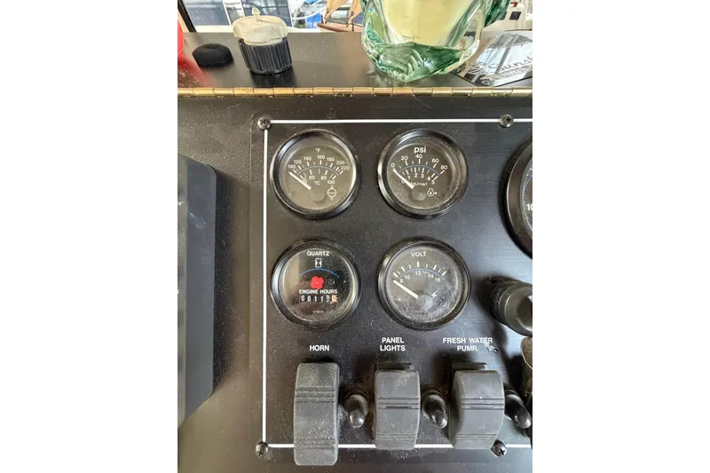 Slide: The Image of Control panel of a 2000 Sunstar 16x65 with gauges and switches. - 9