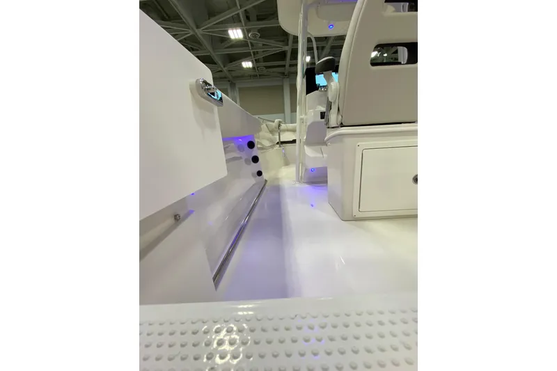 Slide: The Image of 2024 Sailfish 242 CC boat interior with sleek white design and modern features. - 12