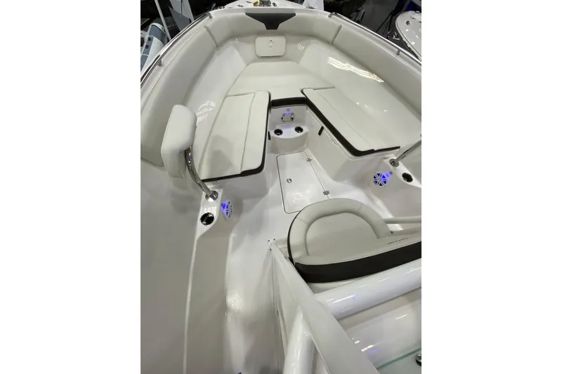 Slide: The Image of 2024 Sailfish 242 CC boat interior with cushioned seating and modern design. - 19