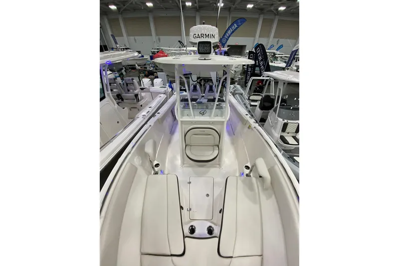 Slide: The Image of 2024 Sailfish 242 CC boat interior with Garmin equipment at a boat show. - 21