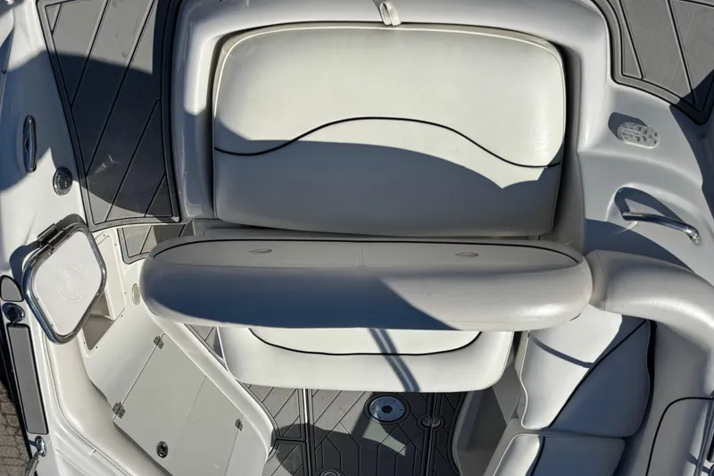 Slide: The Image of 2007 Crownline 240 EX boat interior with white seating and sleek design. - 15