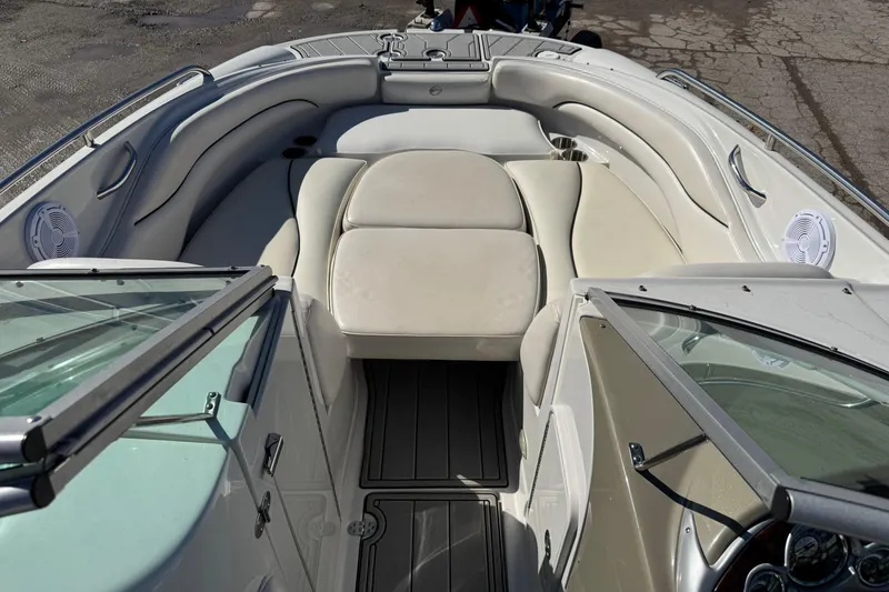 Slide: The Image of 2007 Crownline 240 EX boat interior with beige seating and open windshield. - 17