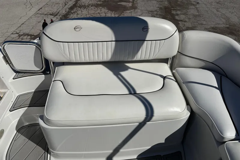 Slide: The Image of 2007 Crownline 240 EX boat interior with white leather seating and shadow details. - 24