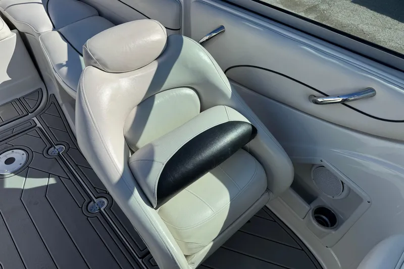 Slide: The Image of 2007 Crownline 240 EX boat interior with white leather seating and sleek design. - 26