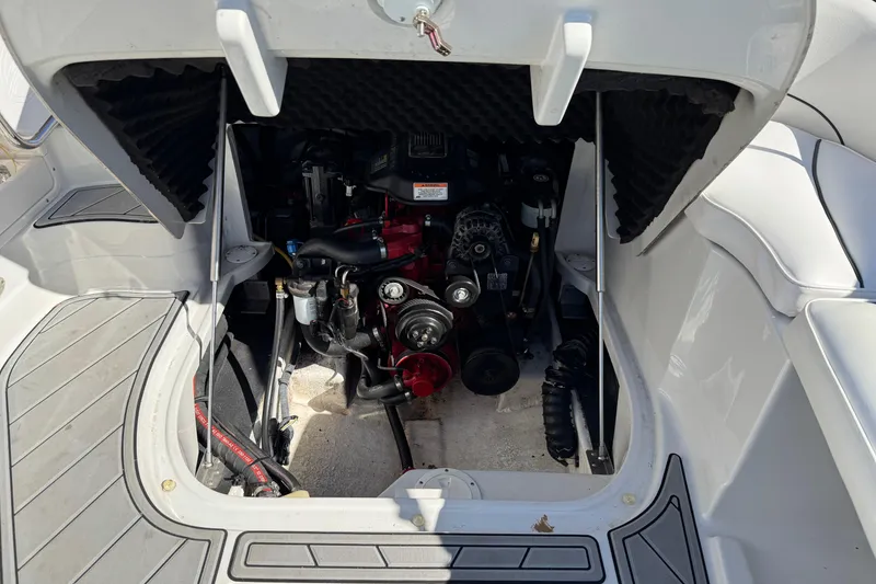 Slide: The Image of Engine compartment of a 2007 Crownline 240 EX boat, showcasing mechanical components. - 27
