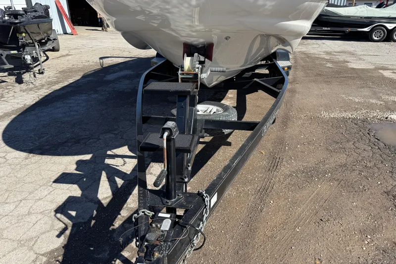 Slide: The Image of 2007 Crownline 240 EX boat on trailer in outdoor setting. - 6