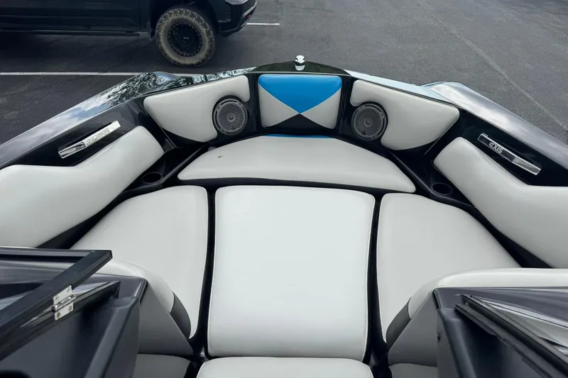 Slide: The Image of Interior of 2011 Axis A20 boat with white and blue seating. - 8