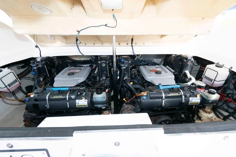 Slide: The Image of Engine compartment of a 2009 Sea Ray 300 SLX boat, showcasing dual engines. - 10