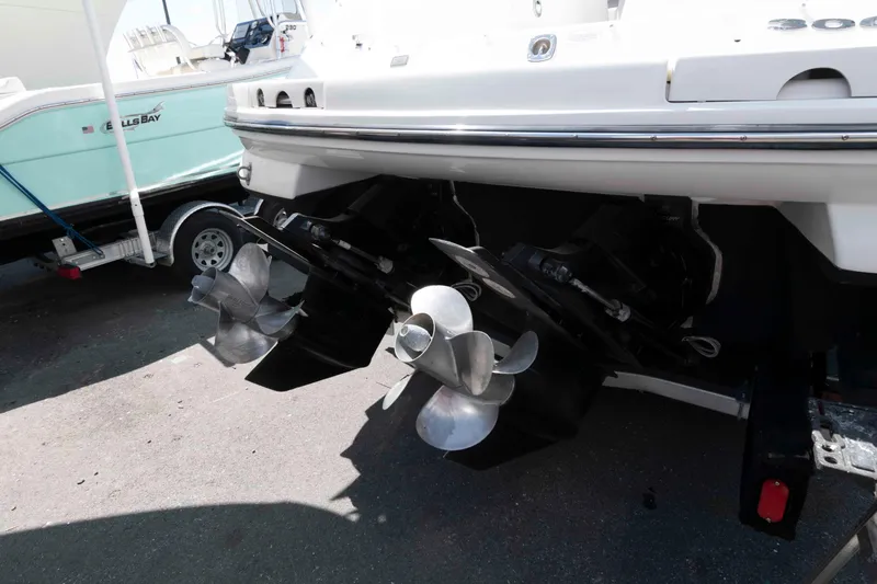 Slide: The Image of Rear view of a 2009 Sea Ray 300 SLX boat with dual propellers. - 11