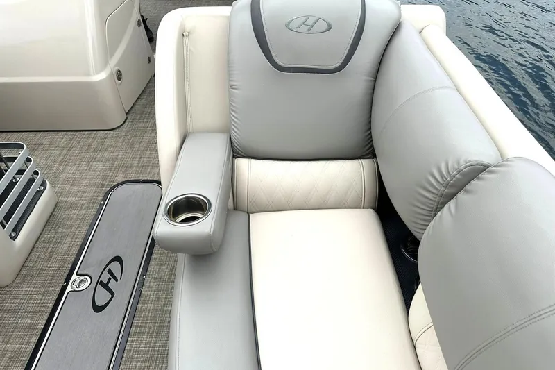 Slide: The Image of Luxurious seating on 2018 Harris Grand Mariner 250 pontoon boat with cup holder. - 21