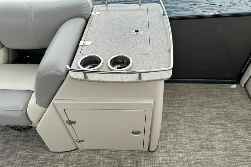 Slide: The Image of 2018 Harris Grand Mariner 250 boat interior with seating and cup holders. - 30