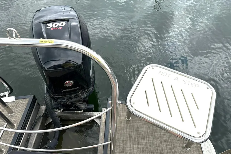 Slide: The Image of 2018 Harris Grand Mariner 250 boat with 300 Pro motor on water. - 36