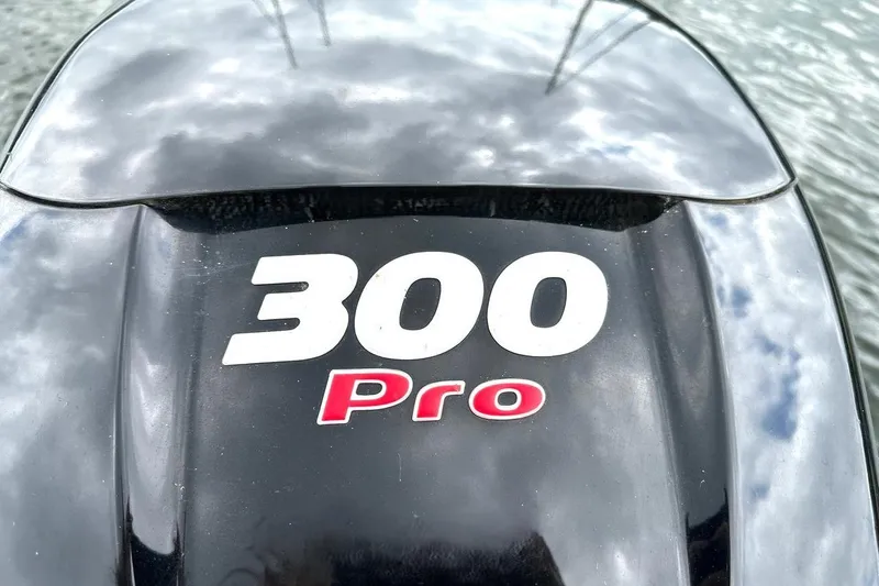 Slide: The Image of Close-up of a 300 Pro engine on a 2018 Harris Grand Mariner 250 boat. - 37