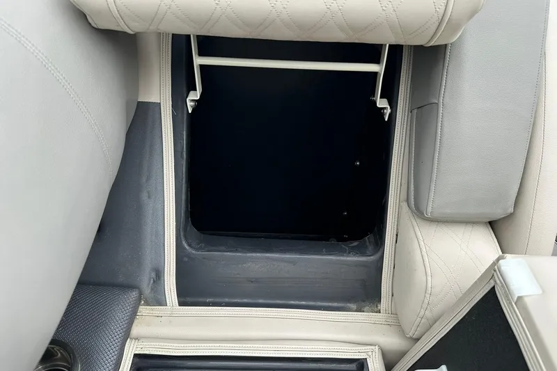 Slide: The Image of Storage compartment in 2018 Harris Grand Mariner 250 boat with beige upholstery. - 47