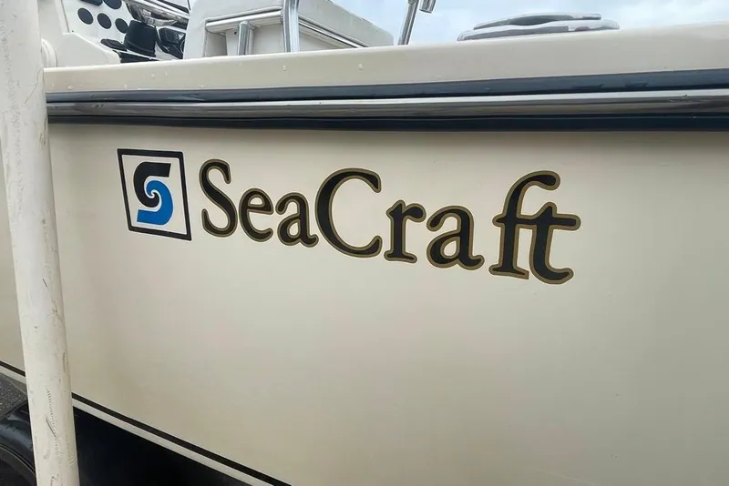 Slide: The Image of 1983 Sea Craft SF18 boat with logo and branding on the side. - 10