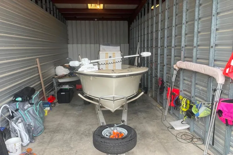 Slide: The Image of 1983 Sea Craft SF18 boat stored in a garage with equipment and accessories. - 11