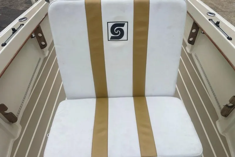 Slide: The Image of White and gold boat seat on 1983 Sea Craft SF18 vessel. - 13