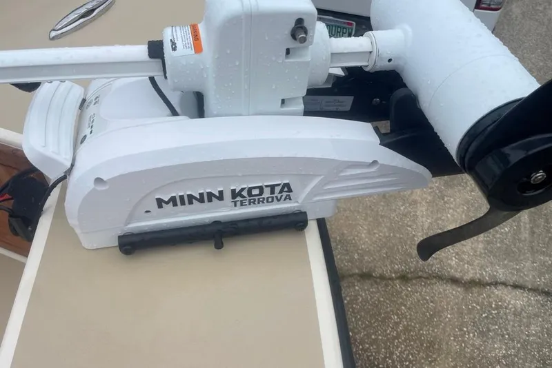 Slide: The Image of Minn Kota Terrova motor on 1983 Sea Craft SF18 boat, wet surface. - 14