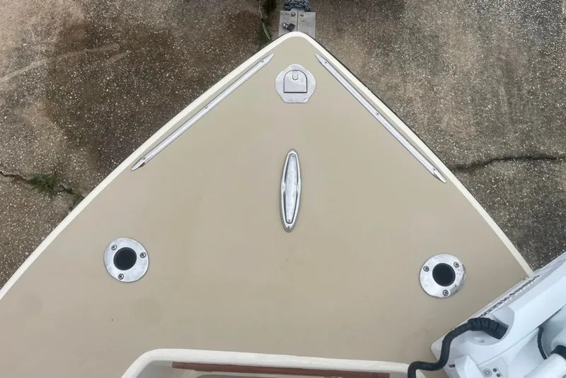 Slide: The Image of Bow of a 1983 Sea Craft SF18 boat with metal fittings and beige deck. - 17