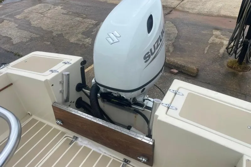 Slide: The Image of 1983 Sea Craft SF18 boat with Suzuki outboard motor, showcasing deck and engine details. - 21