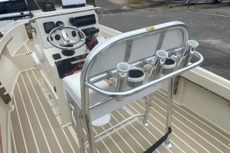 Slide: The Image of 1983 Sea Craft SF18 boat interior with steering console and rod holders. - 22