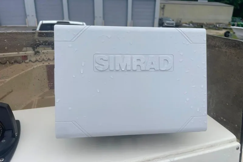 Slide: The Image of Simrad marine equipment on a 1983 Sea Craft SF18 boat, wet from rain. - 25