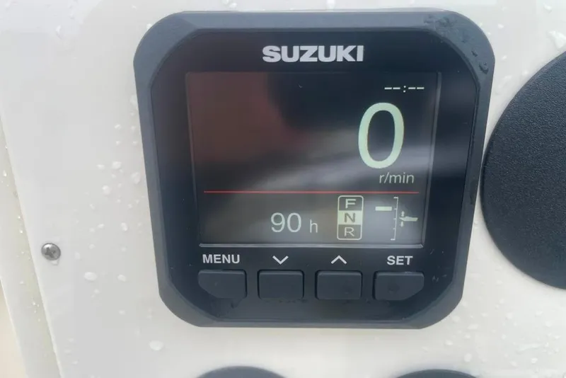 Slide: The Image of Suzuki digital display on 1983 Sea Craft SF18 boat, showing 0 RPM and 90 hours. - 26