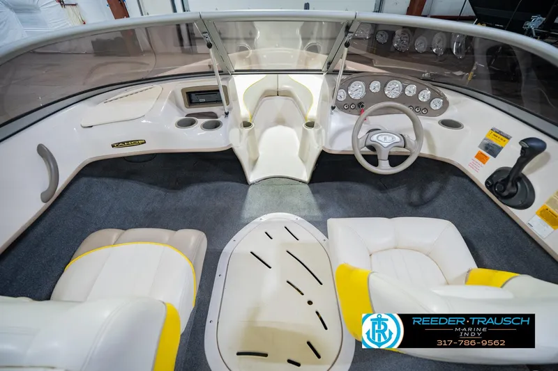 Slide: The Image of Interior of a 2005 Tahoe Q4 boat with steering wheel and dashboard controls. - 17