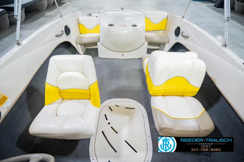 Slide: The Image of 2005 Tahoe Q4 boat interior with yellow and white seating, displayed at Reeder-Trausch Marine. - 20
