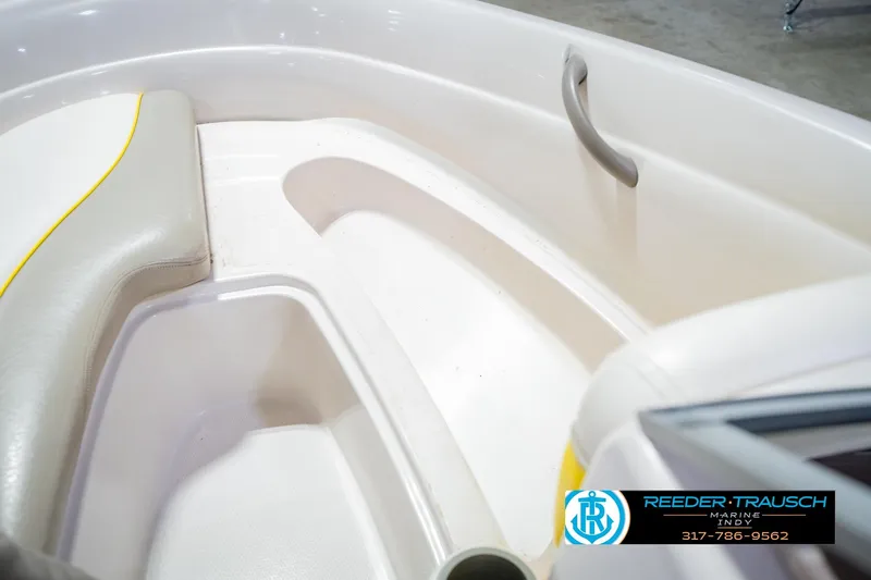 Slide: The Image of Interior of a 2005 Tahoe Q4 boat with seating and handle. - 23