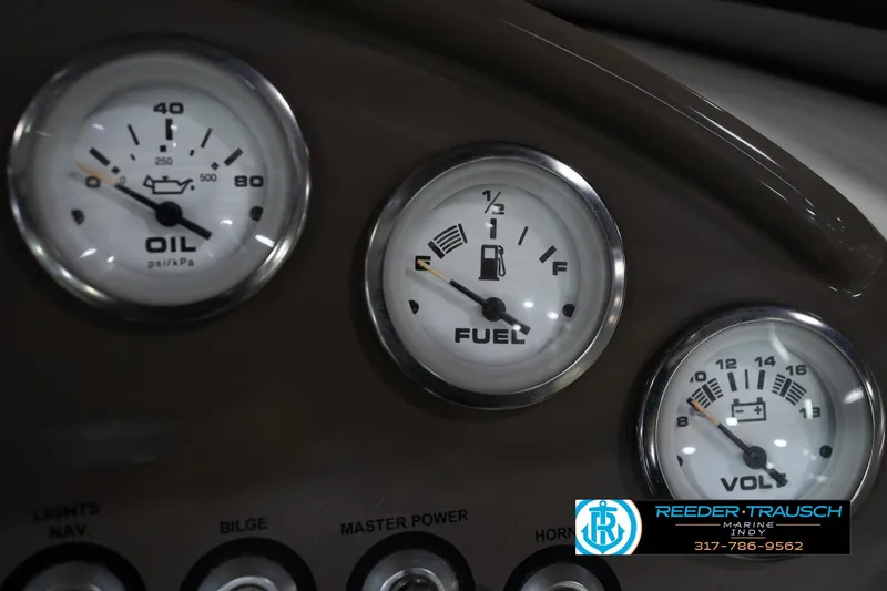 Slide: The Image of Dashboard gauges of a 2005 Tahoe Q4 boat, displaying oil, fuel, and voltage levels. - 30