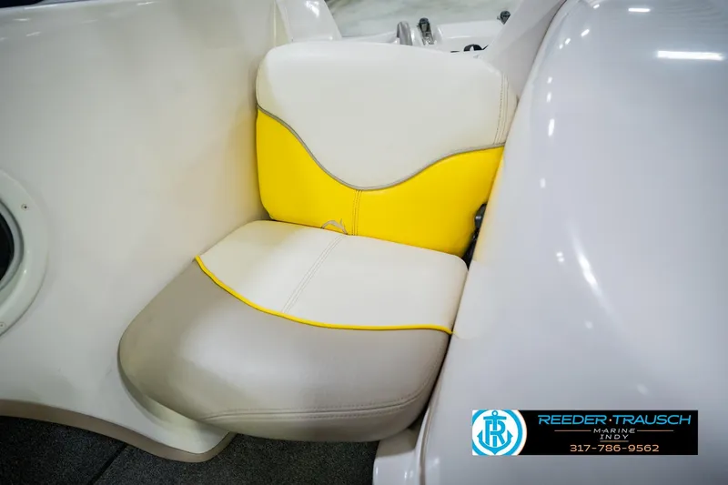 Slide: The Image of Yellow and white seat in a 2005 Tahoe Q4 boat interior. - 37