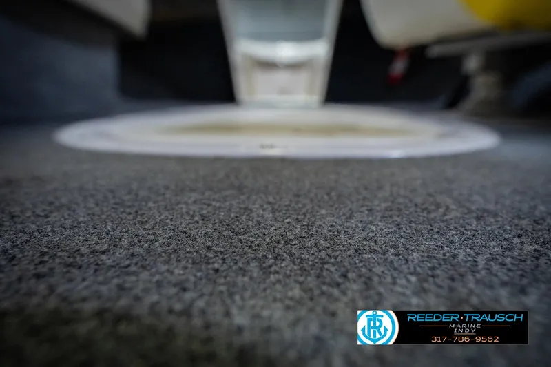 Slide: The Image of Carpeted interior of a 2005 Tahoe Q4 boat, featuring Reeder Trausch Marine branding. - 41