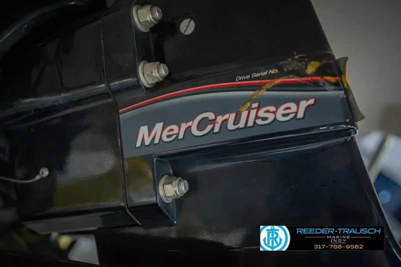 Slide: The Image of Close-up of a 2005 Tahoe Q4 MerCruiser engine component with branding and serial number. - 43