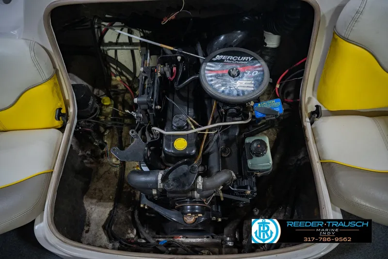 Slide: The Image of 2005 Tahoe Q4 boat engine, Mercury MerCruiser 3.0, with yellow-accented seating. - 44